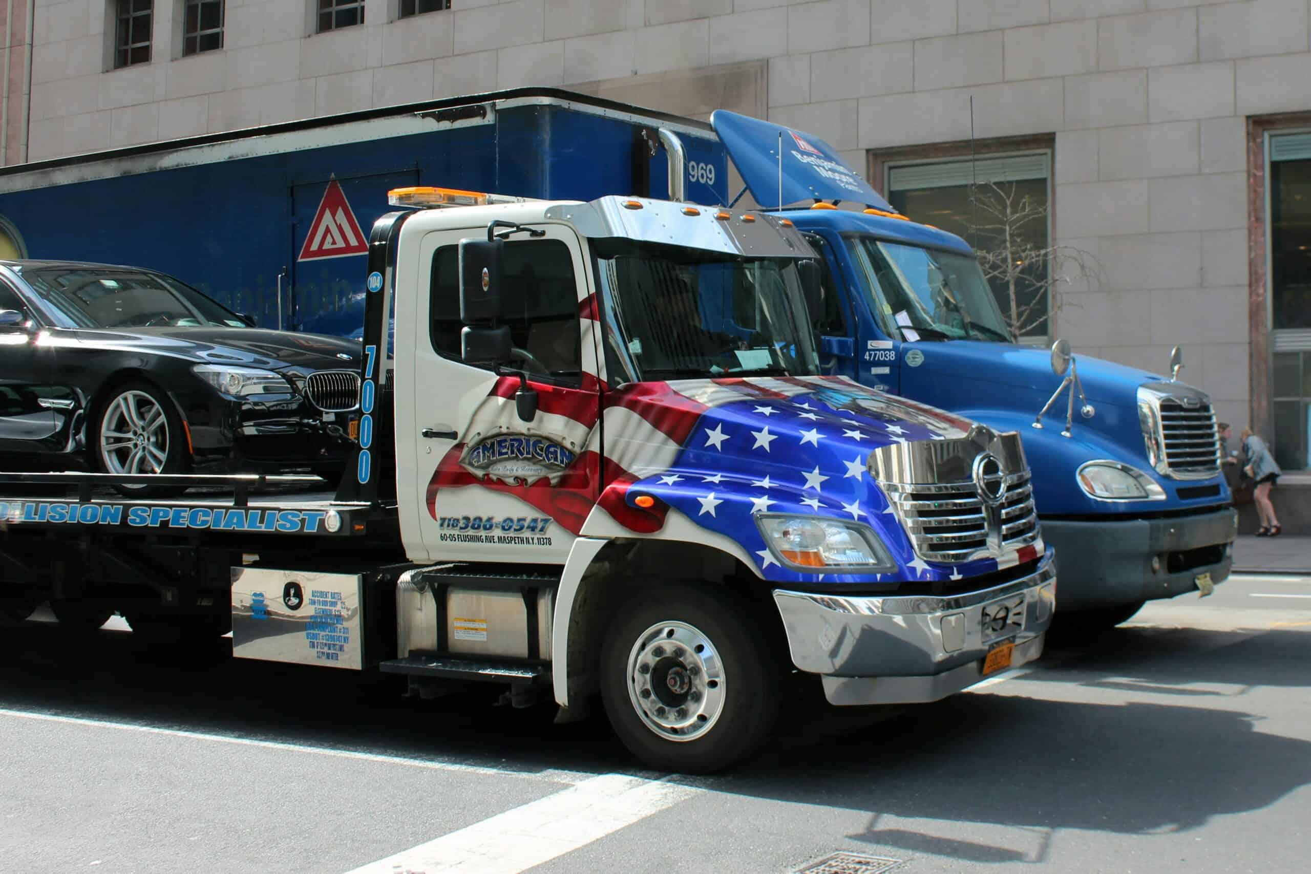Truck with American flag showing pride and strength of US truckers